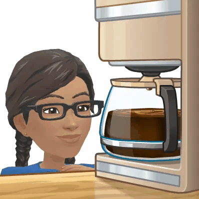 Ree happily watching a large jug of coffee brew