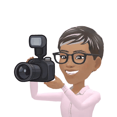 Ree looking through a camera and taking photographs